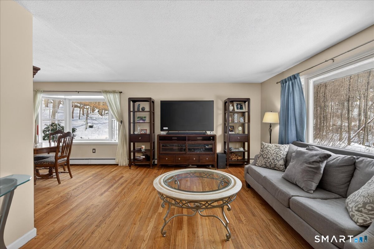 31 Longview Drive Ridgefield, CT 06877 - Photo 12 of 39 a living room with furniture and a flat screen tv