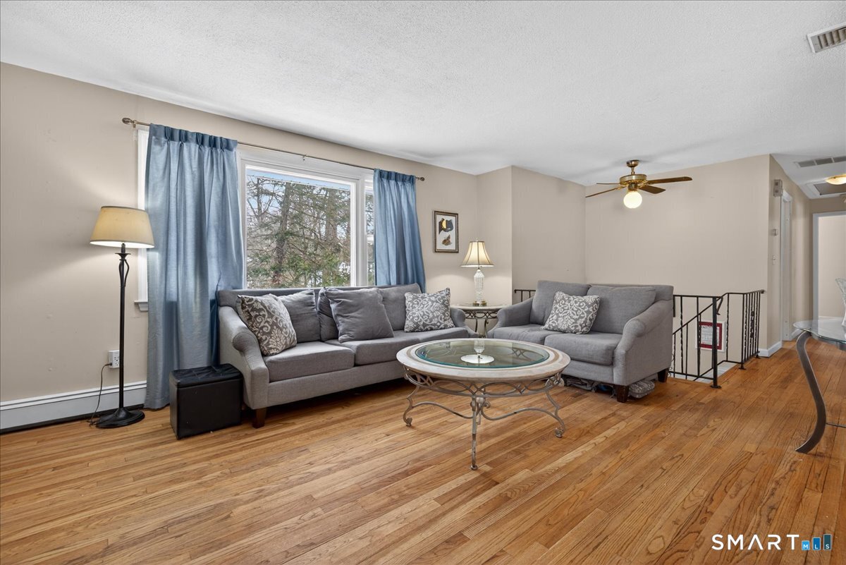 31 Longview Drive Ridgefield, CT 06877 - Photo 14 of 39 a living room with furniture and a large window
