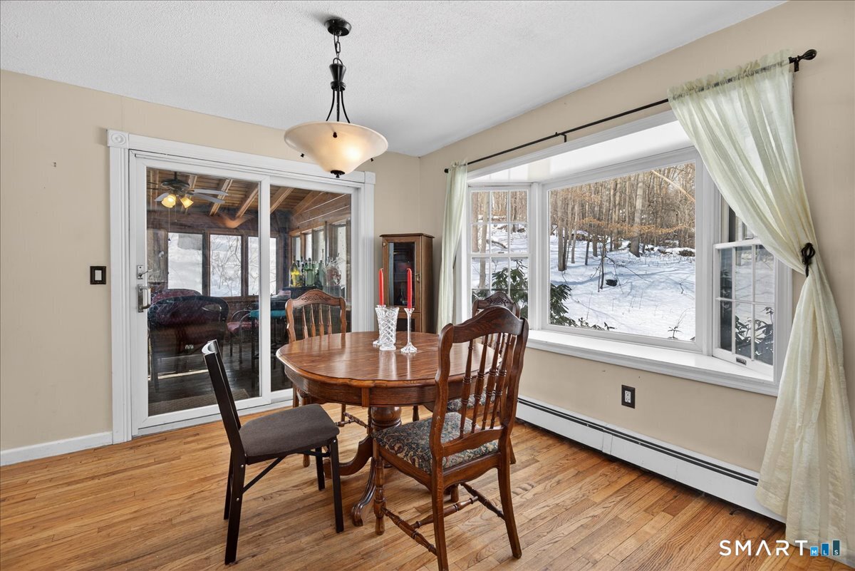 31 Longview Drive Ridgefield, CT 06877 - Photo 15 of 39 a dining room with furniture window wooden floor