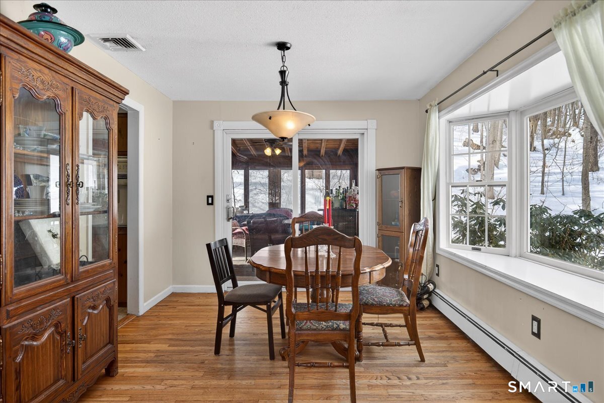 31 Longview Drive Ridgefield, CT 06877 - Photo 16 of 39 a view of a dining room with furniture window and wooden floor