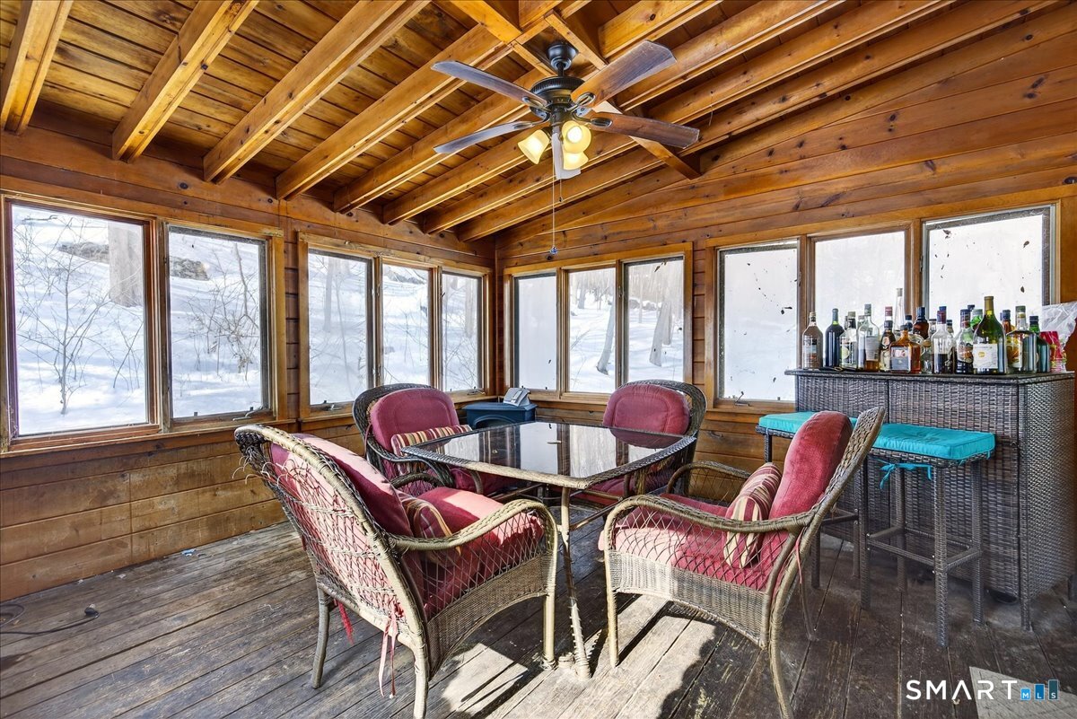 31 Longview Drive Ridgefield, CT 06877 - Photo 17 of 39 a dining room with furniture and a floor to ceiling window