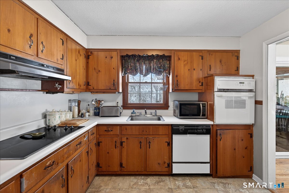 31 Longview Drive Ridgefield, CT 06877 - Photo 20 of 39 a kitchen with a sink stove and cabinets