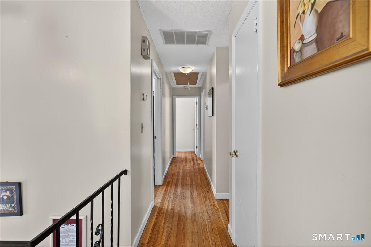 31 Longview Drive Ridgefield, CT 06877 - Photo 26 of 39 a view of a hallway with wooden floor and entryway