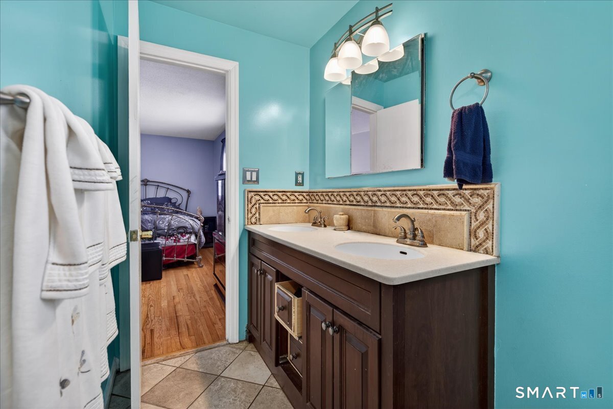 31 Longview Drive Ridgefield, CT 06877 - Photo 27 of 39 a bathroom with a sink and a mirror