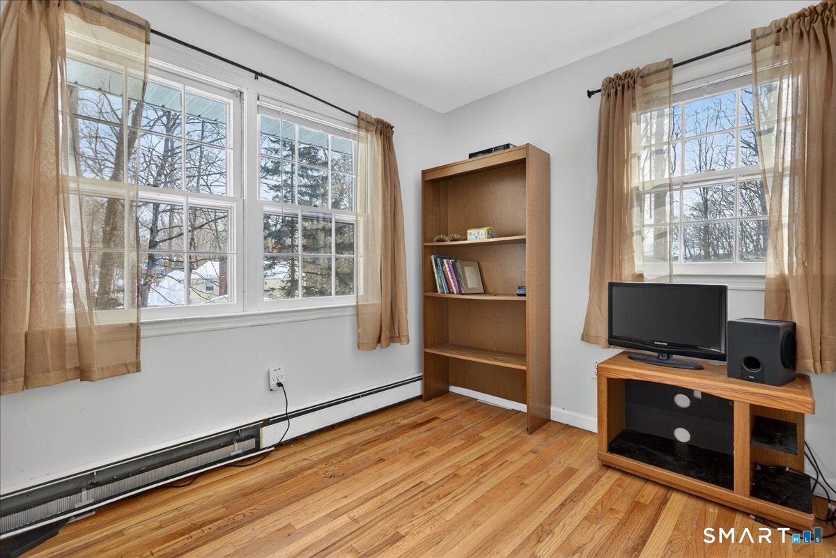 31 Longview Drive Ridgefield, CT 06877 - Photo 33 of 39 a room with furniture and a flat screen tv