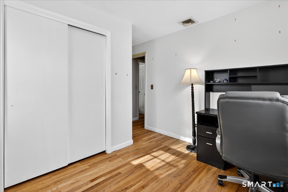 31 Longview Drive Ridgefield, CT 06877 - Photo 34 of 39 a view of livingroom with furniture and wooden floor