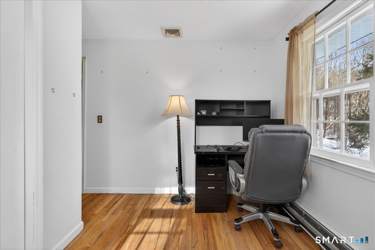 31 Longview Drive Ridgefield, CT 06877 - Photo 35 of 39 a view of a workspace with furniture and wooden floor