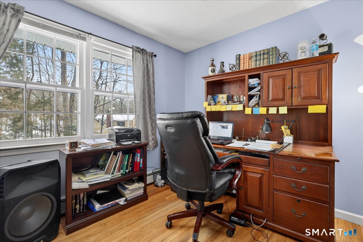 31 Longview Drive Ridgefield, CT 06877 - Photo 36 of 39 a view of a workspace with furniture and a window