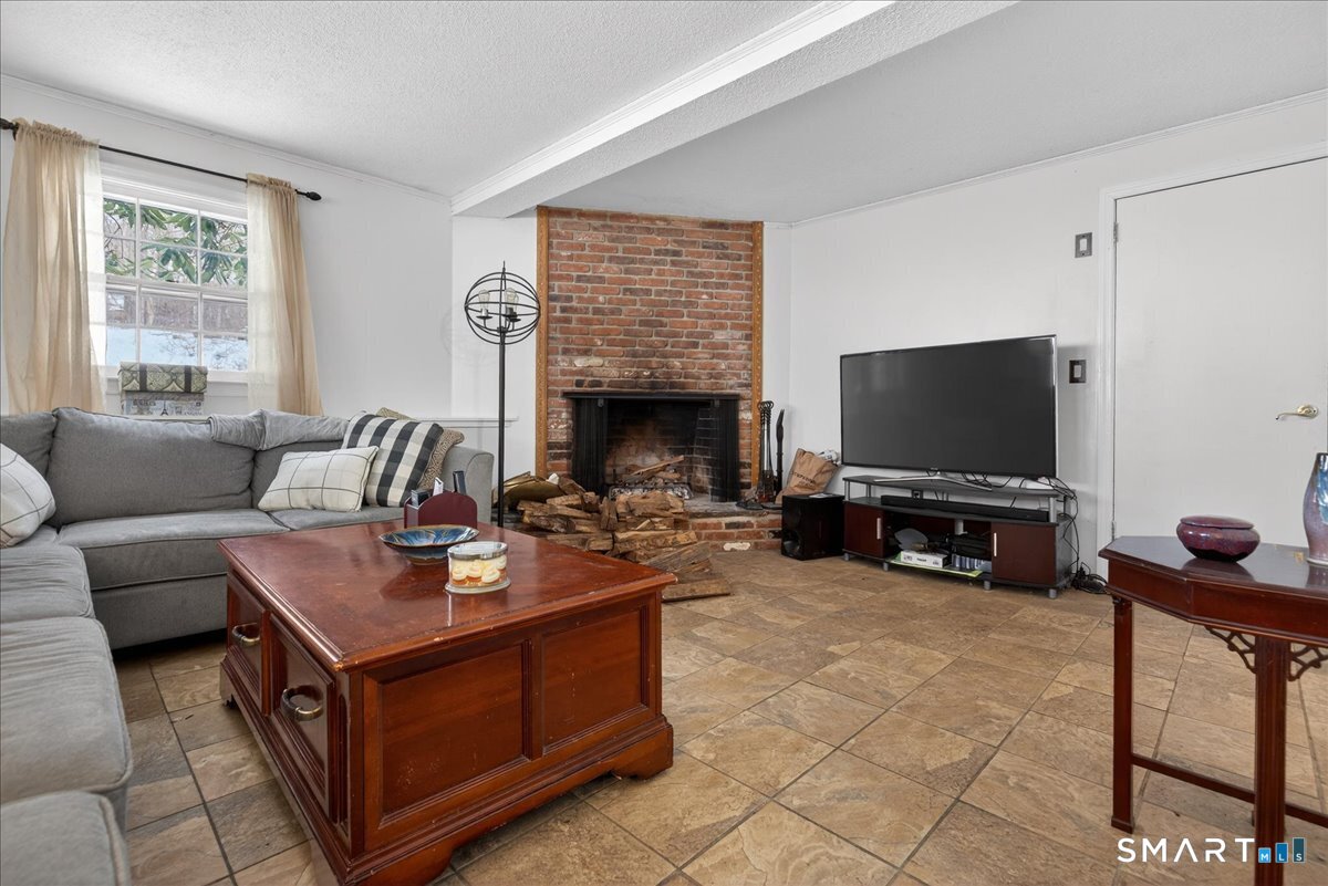 31 Longview Drive Ridgefield, CT 06877 - Photo 37 of 39 a living room with furniture and a flat screen tv