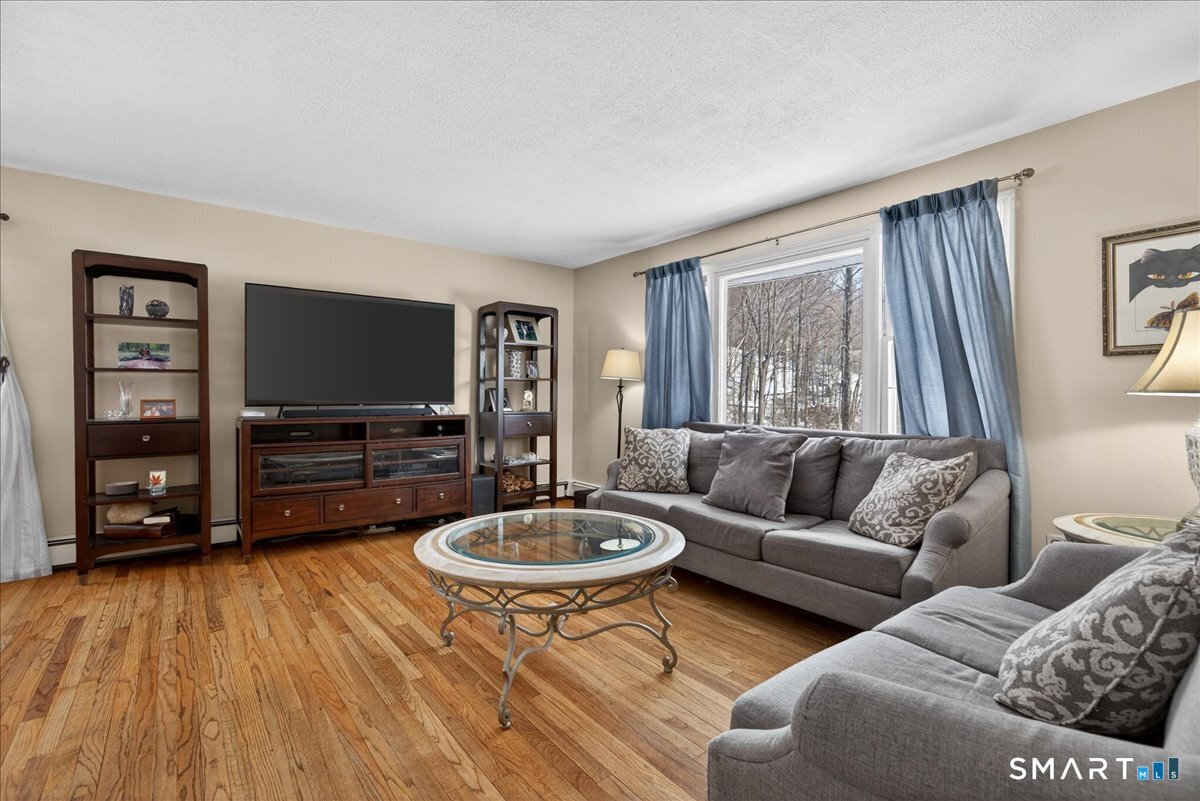 31 Longview Drive Ridgefield, CT 06877 - Photo 6 of 39 a living room with furniture and a flat screen tv
