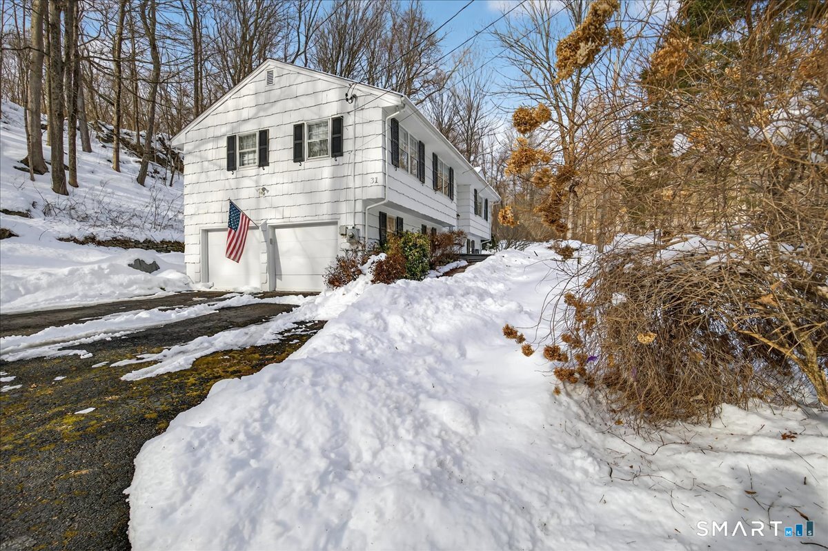 31 Longview Drive Ridgefield, CT 06877 - Photo 7 of 39 a white house with a large tree with yard