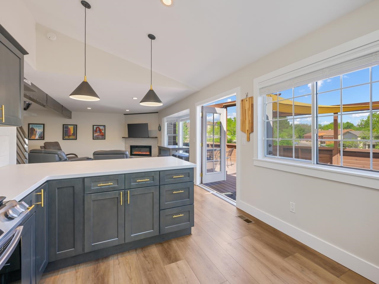 383 Explorer Court, Unit B Grand Junction, CO 81507 - Photo 14 of 40 a kitchen with stainless steel appliances granite countertop a sink a stove and a wooden floor