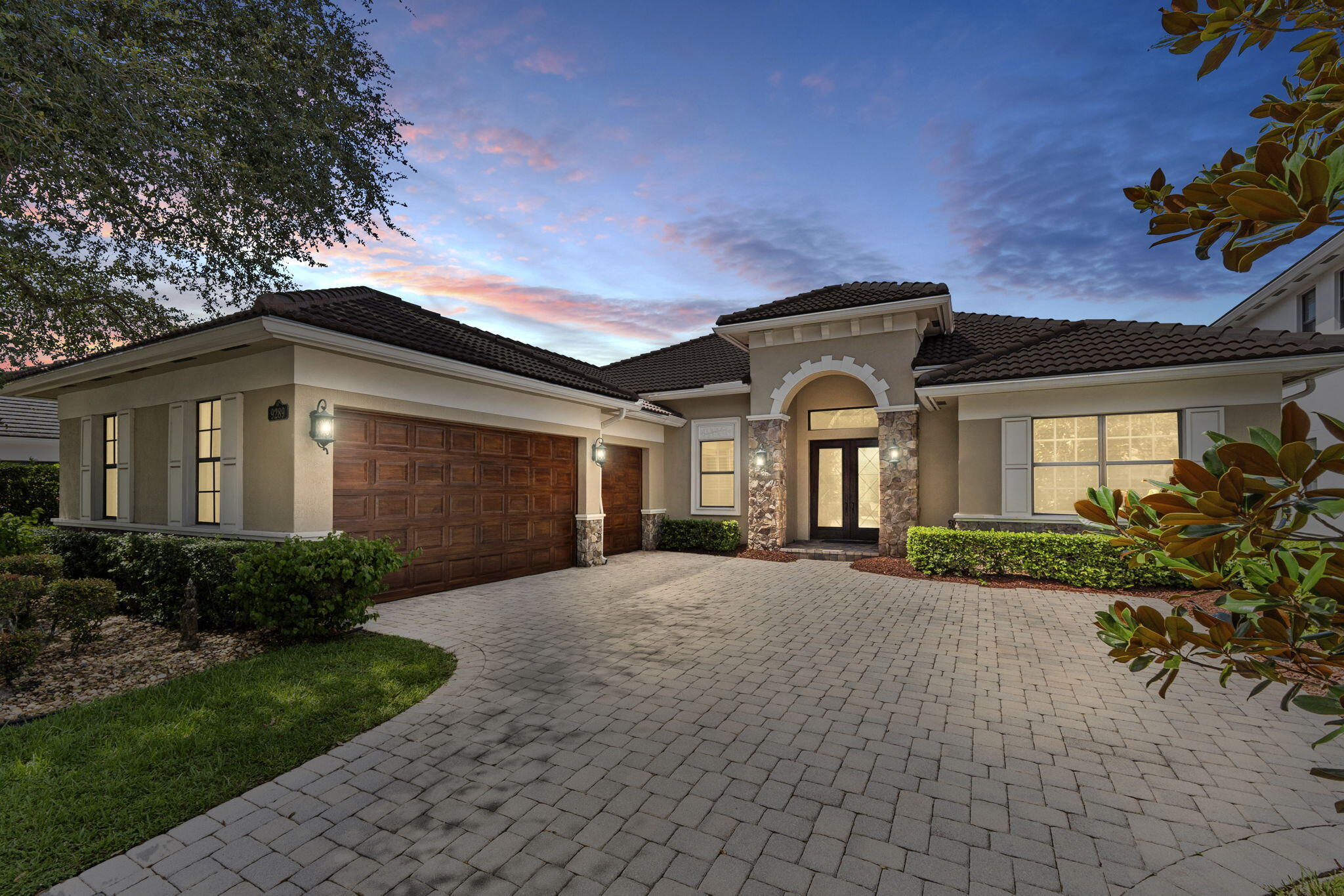 9289 Equus Circle Boynton Beach, FL 33472 - Photo 1 of 72 a front view of a house with a yard and outdoor seating