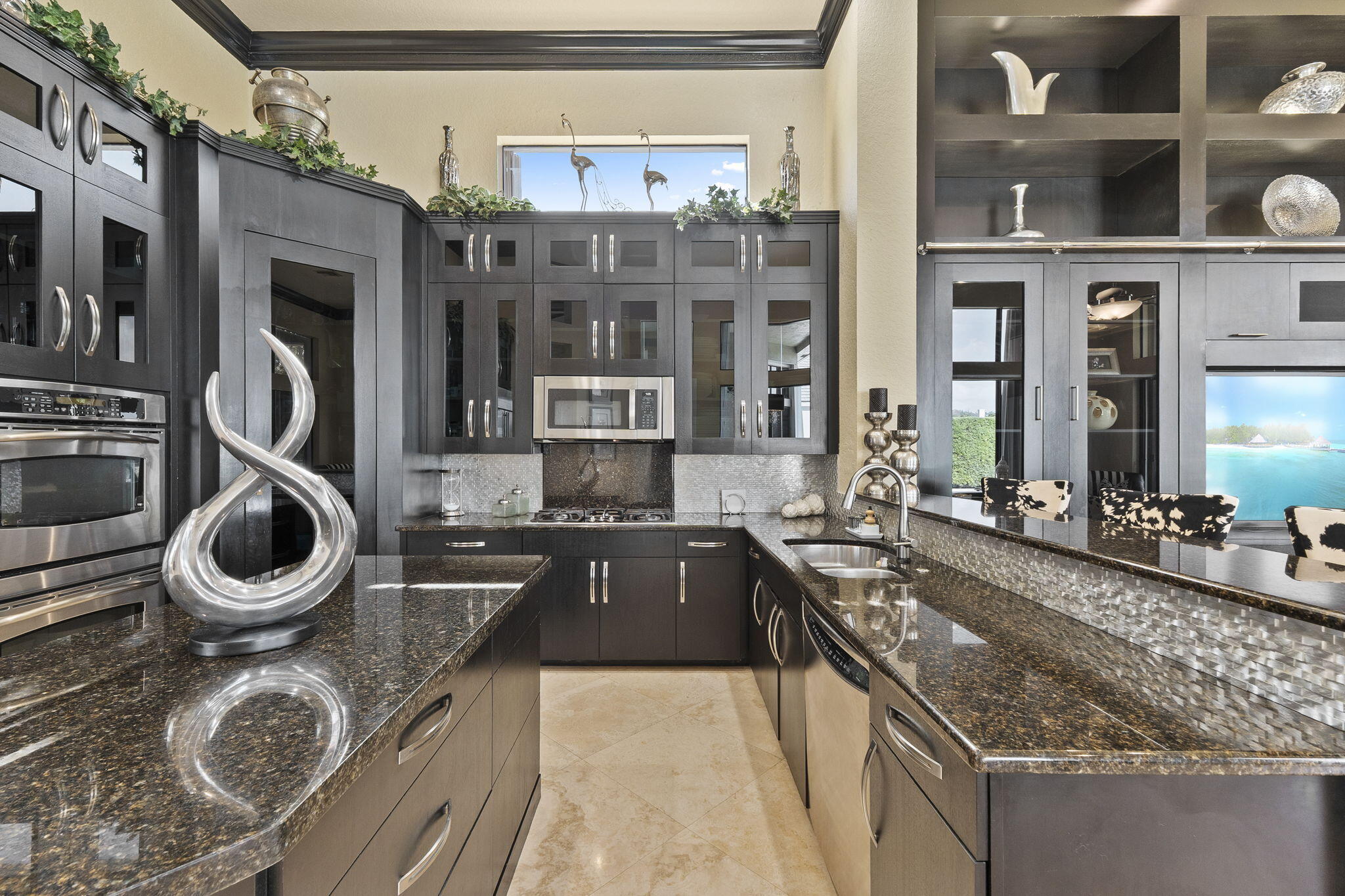 9289 Equus Circle Boynton Beach, FL 33472 - Photo 22 of 72 a large kitchen with stainless steel appliances granite countertop a sink and cabinets