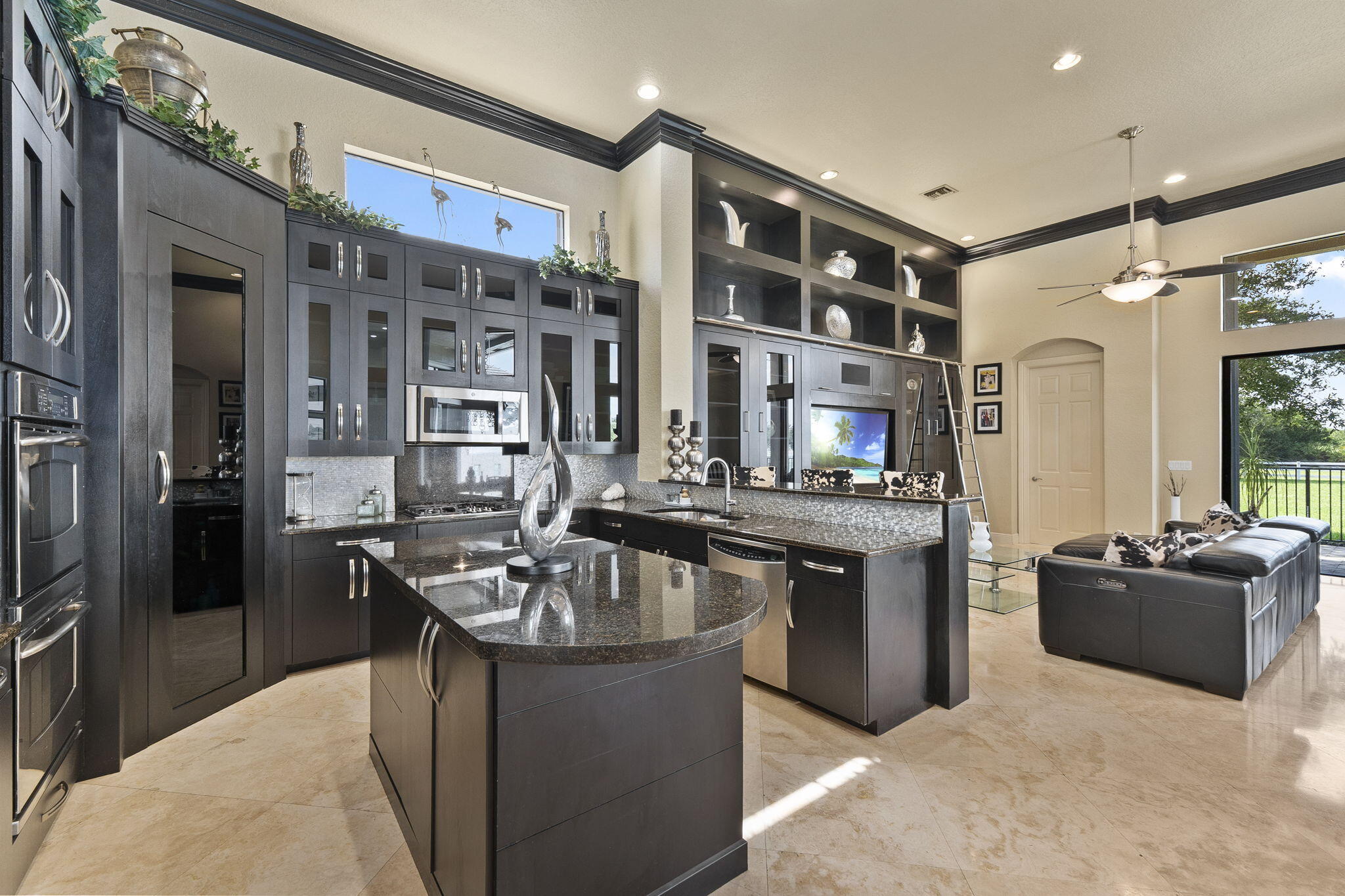9289 Equus Circle Boynton Beach, FL 33472 - Photo 23 of 72 a kitchen with stainless steel appliances granite countertop a sink and a refrigerator