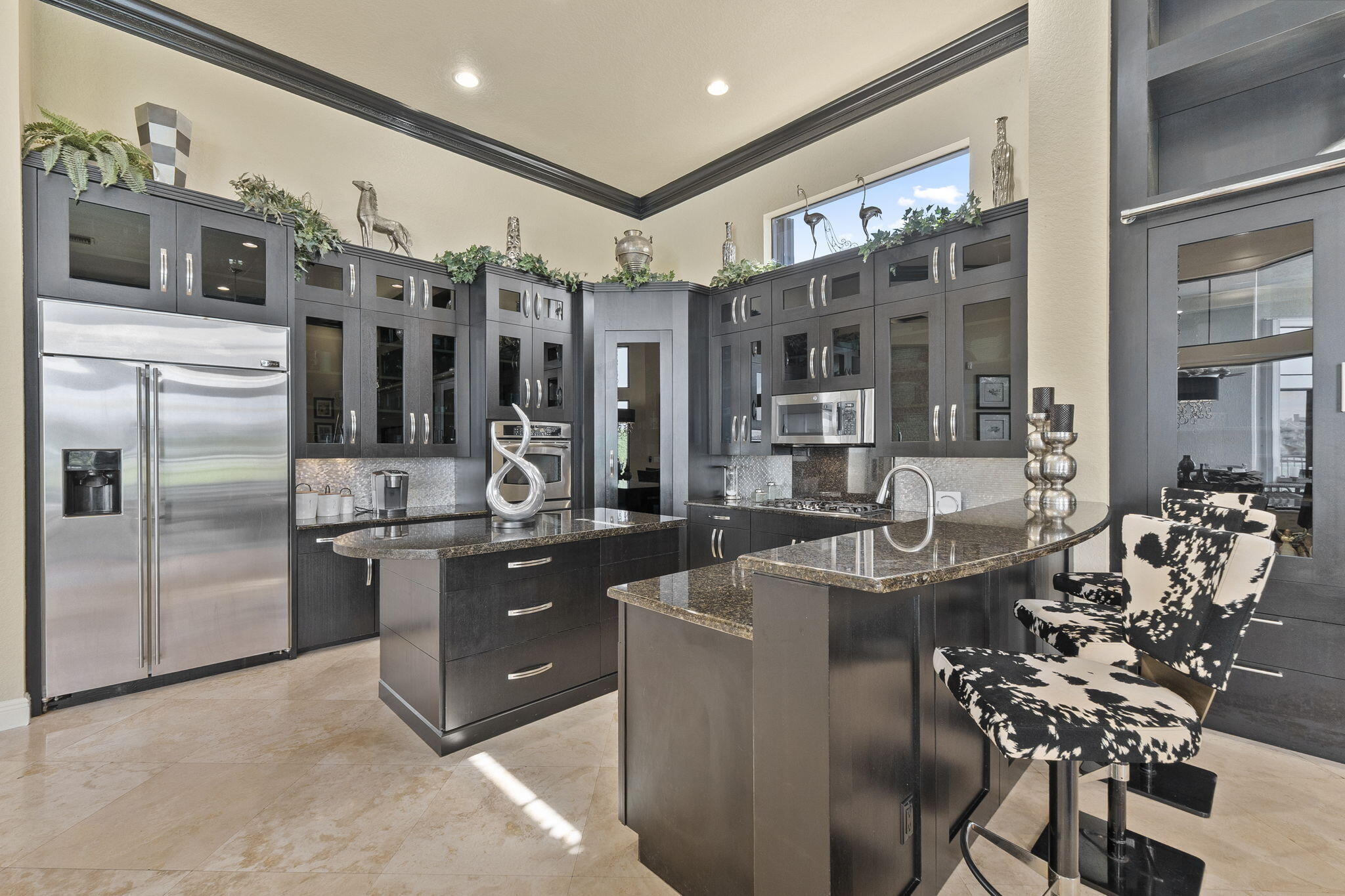 9289 Equus Circle Boynton Beach, FL 33472 - Photo 24 of 72 a kitchen with stainless steel appliances granite countertop a sink and cabinets