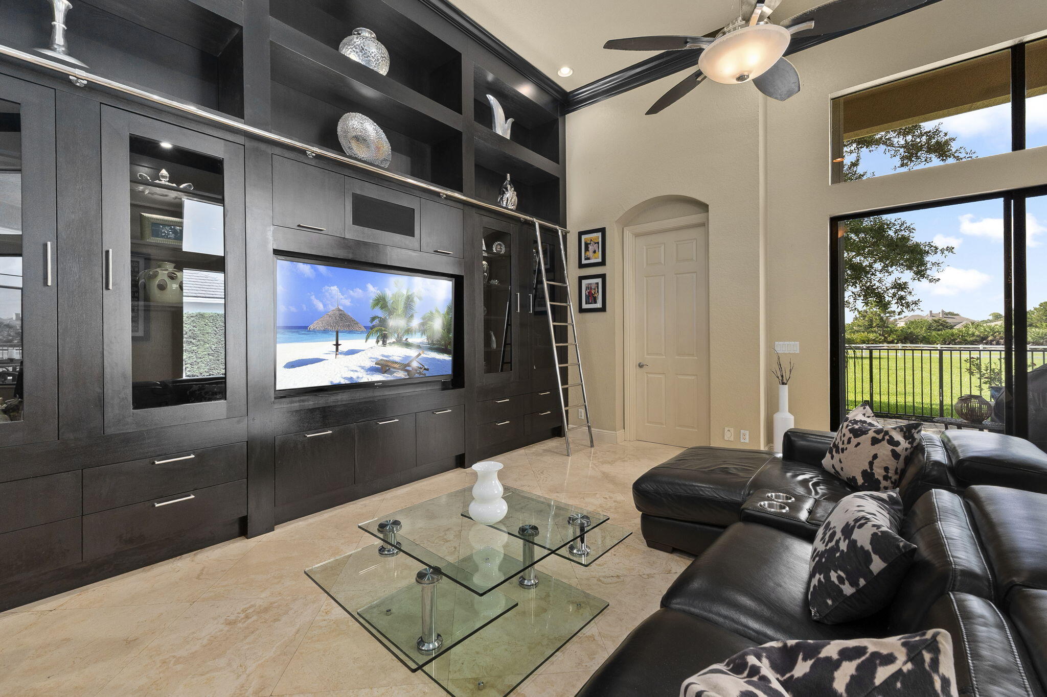 9289 Equus Circle Boynton Beach, FL 33472 - Photo 30 of 72 a living room with furniture a large window and flat screen tv