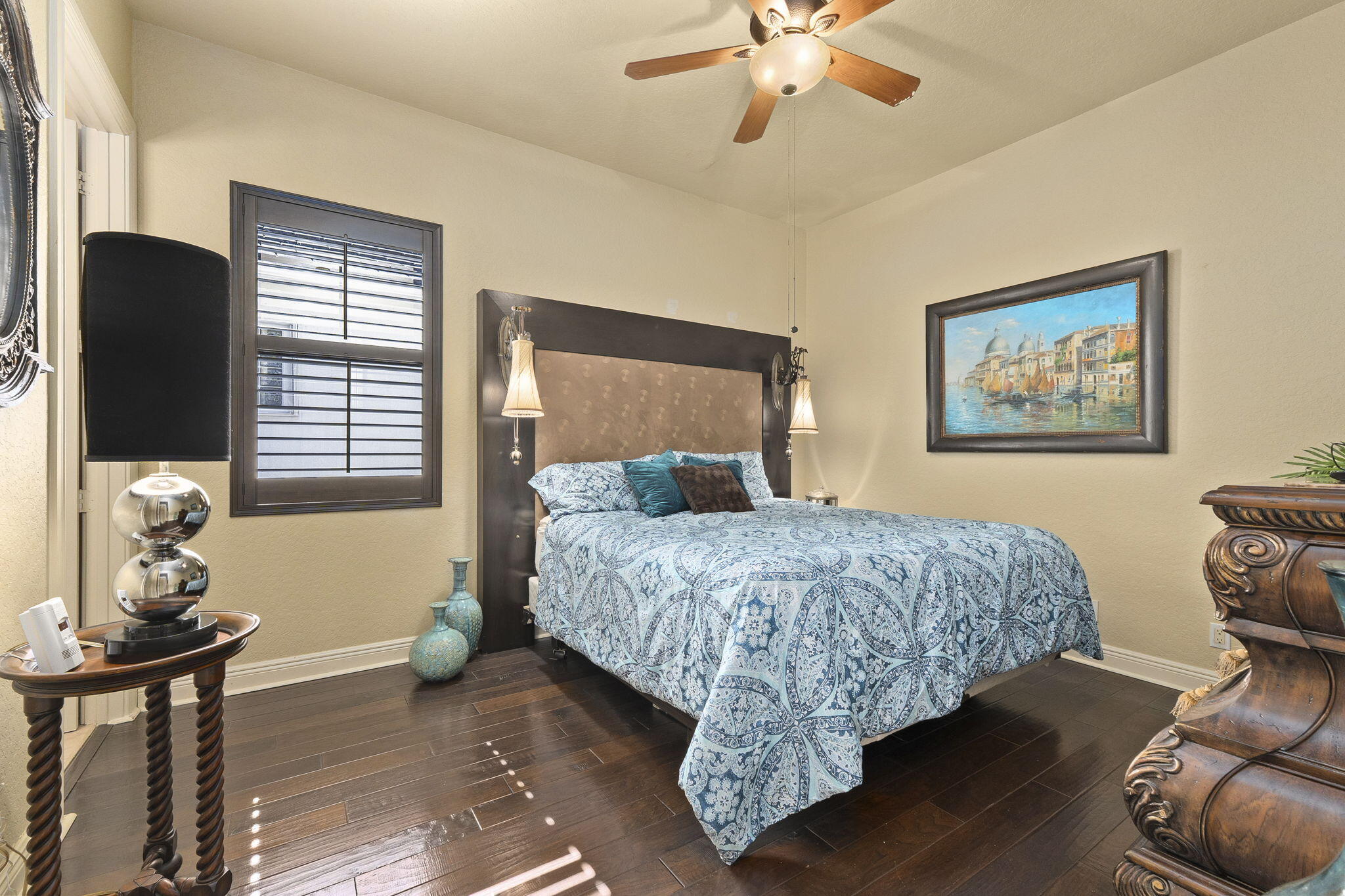 9289 Equus Circle Boynton Beach, FL 33472 - Photo 34 of 72 a bedroom with a bed and wooden floor