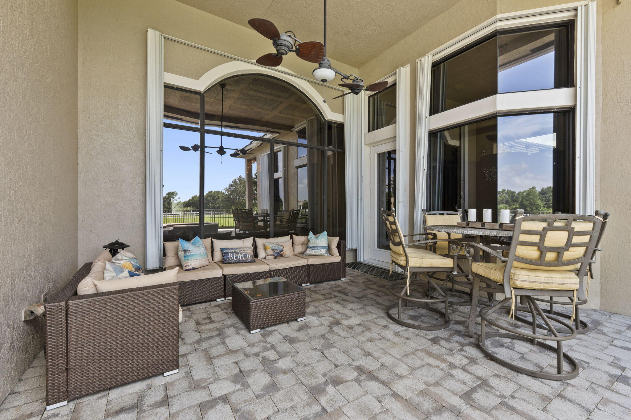 9289 Equus Circle Boynton Beach, FL 33472 - Photo 39 of 72 a dining room with furniture and a large window
