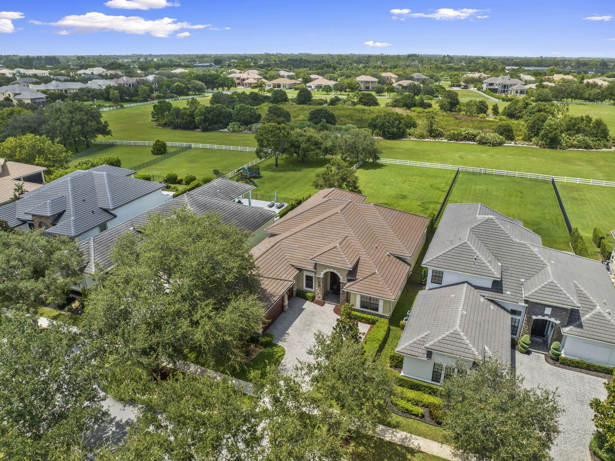 9289 Equus Circle Boynton Beach, FL 33472 - Photo 53 of 72 an aerial view of a house with a garden