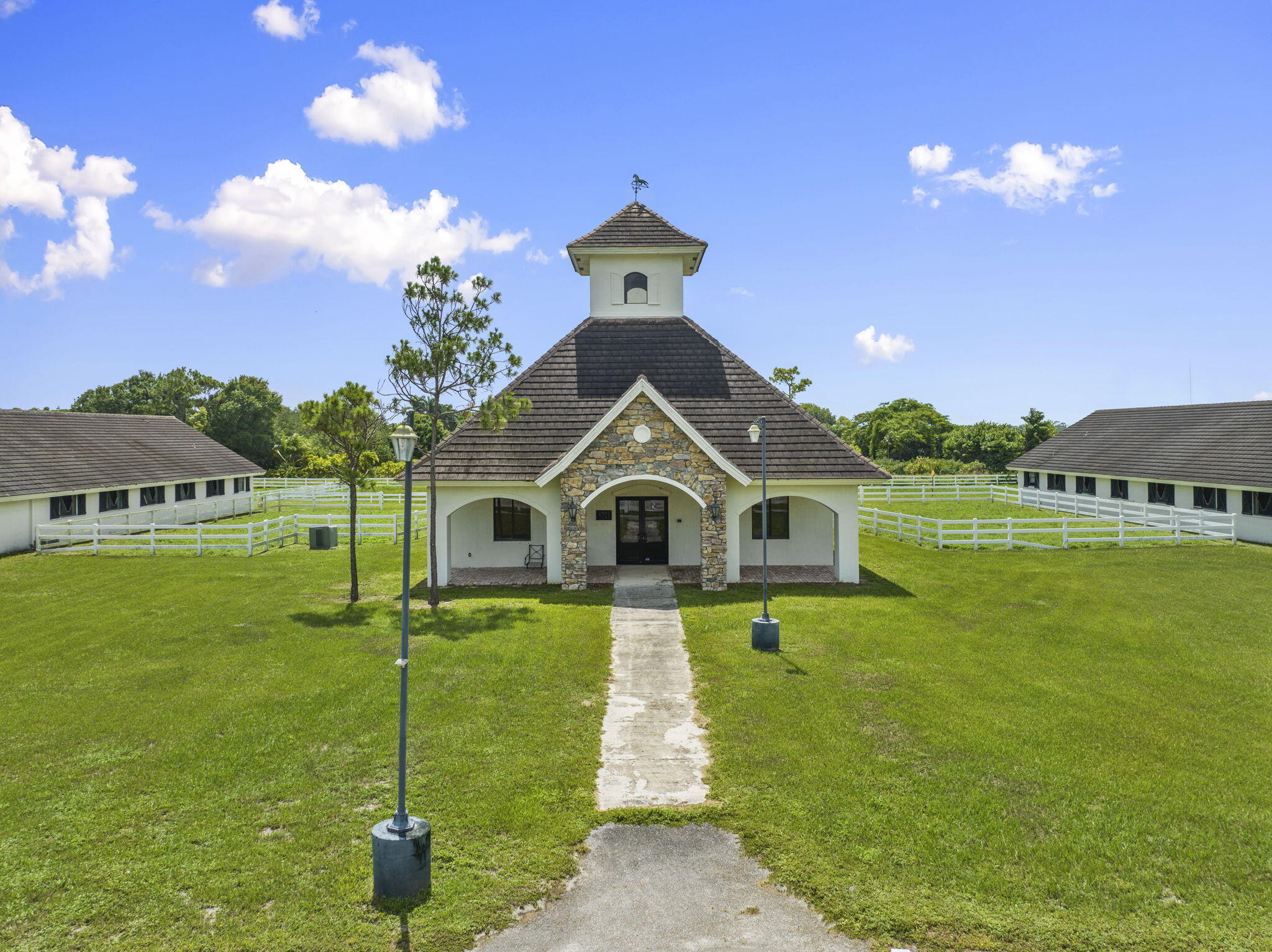 9289 Equus Circle Boynton Beach, FL 33472 - Photo 66 of 72 a front view of a house with a garden and yard