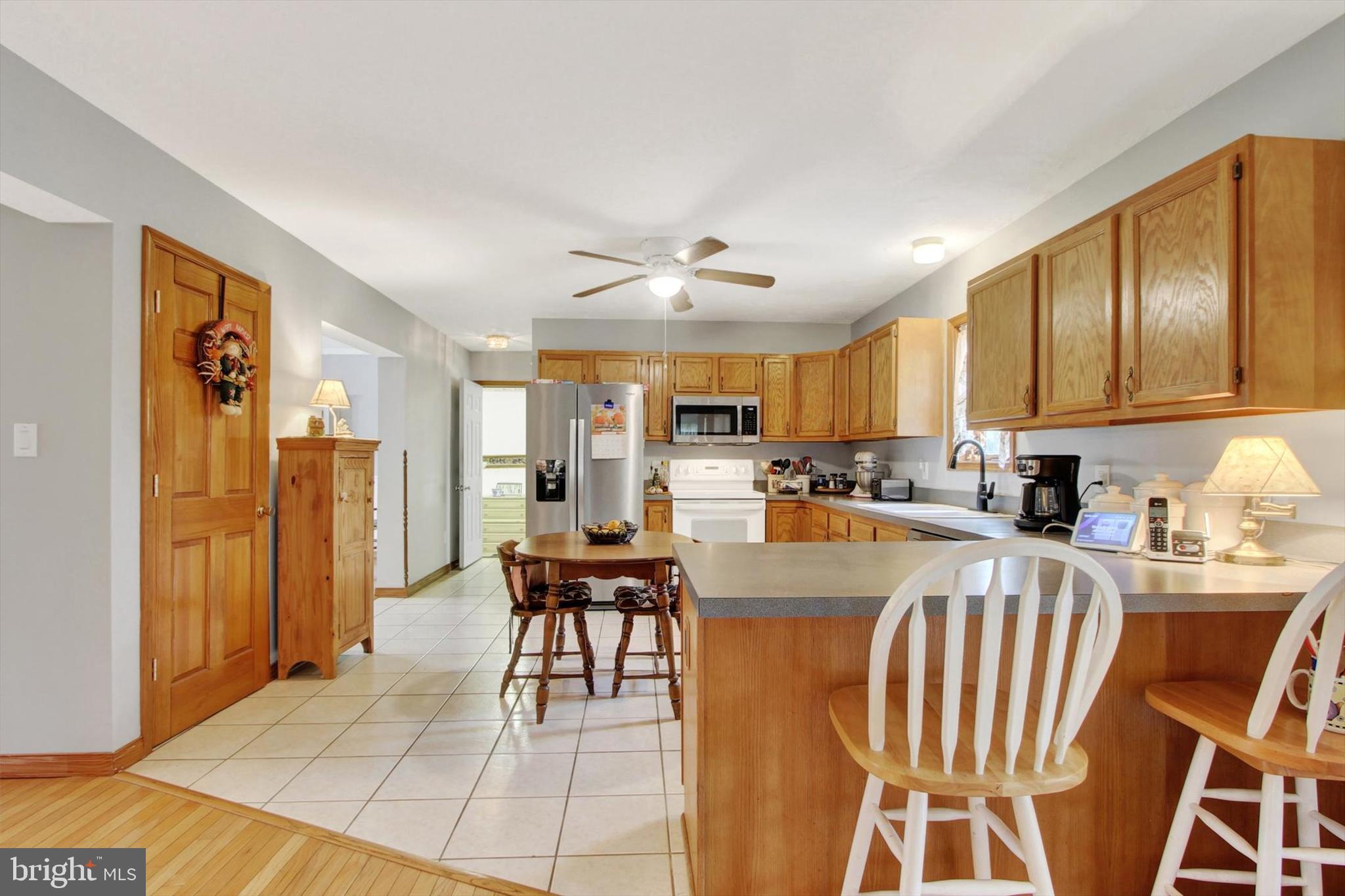 3744 Blue Hill Road Hanover, PA 17331 - Photo 12 of 32 a kitchen with stainless steel appliances granite countertop a stove a sink dishwasher and a refrigerator with cabinets