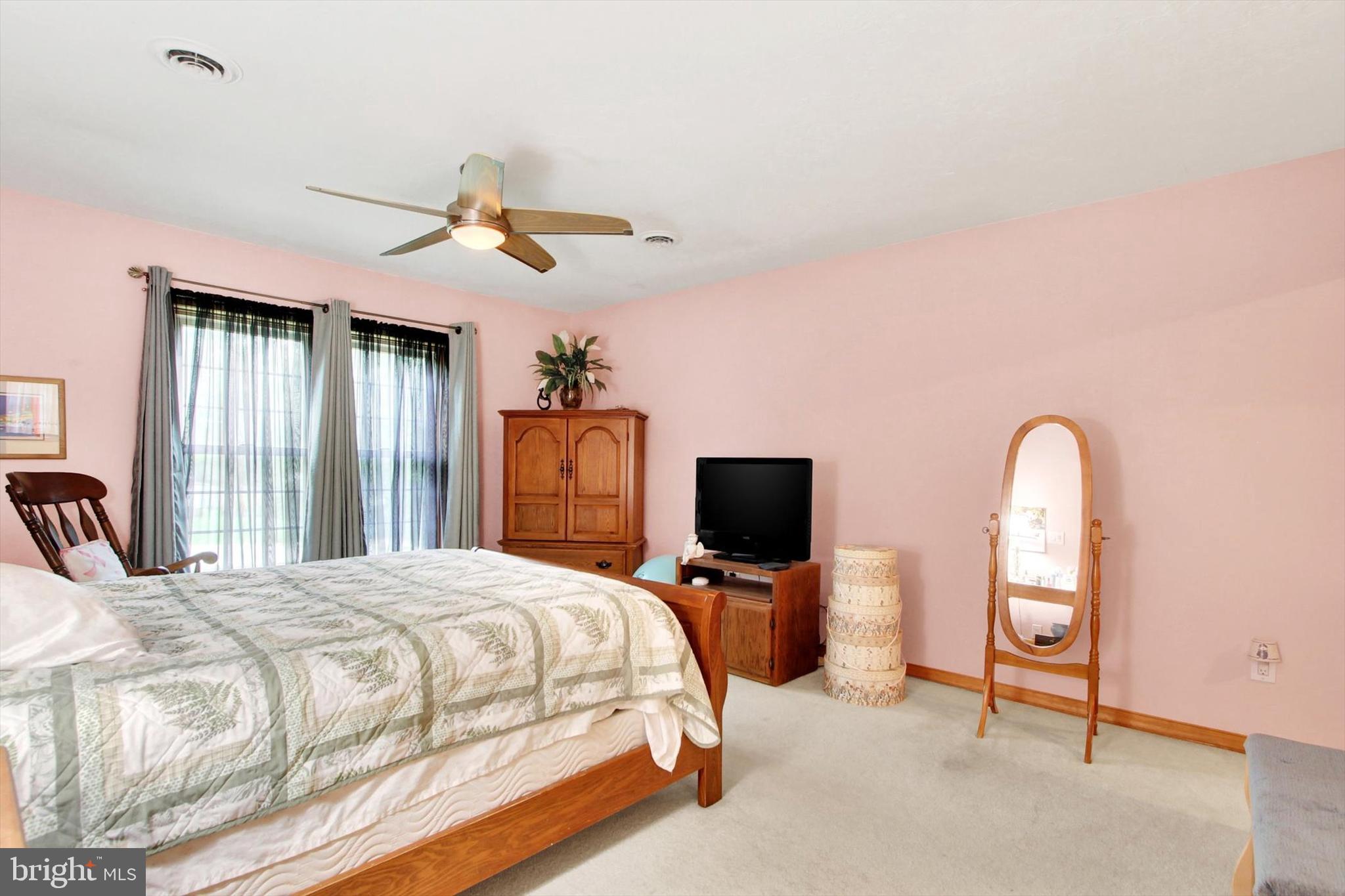 3744 Blue Hill Road Hanover, PA 17331 - Photo 20 of 32 a bedroom with a bed and a flat screen tv