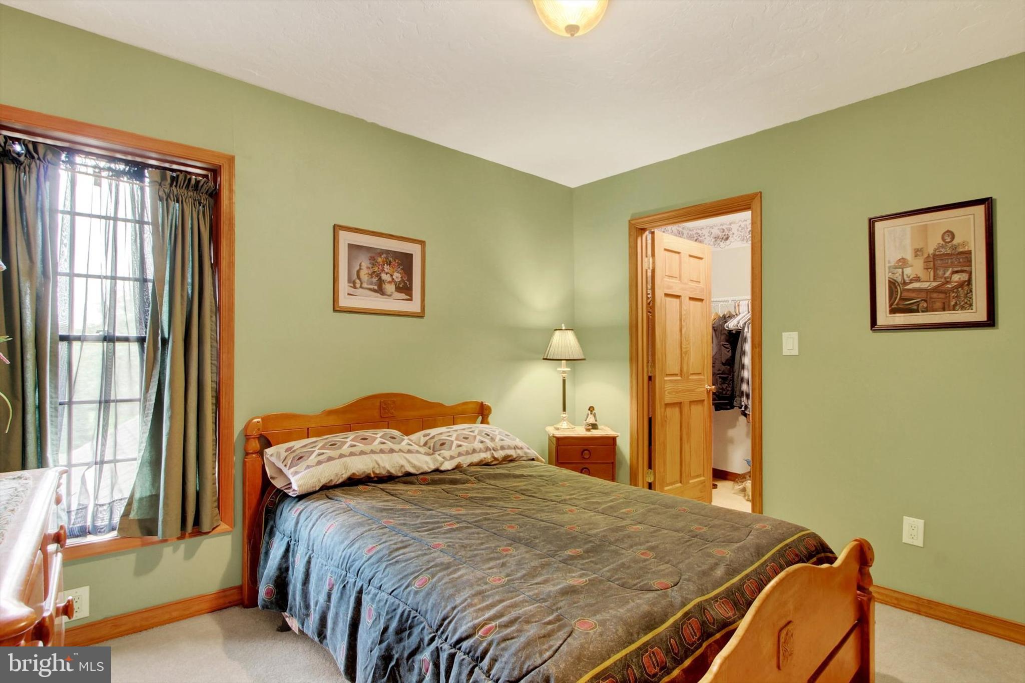 3744 Blue Hill Road Hanover, PA 17331 - Photo 22 of 32 a bedroom with a bed and wooden floor