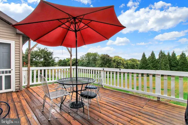 a view of balcony with wooden floor and outdoor space