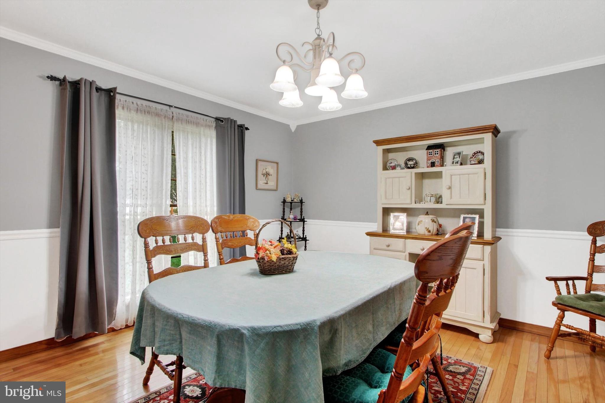 3744 Blue Hill Road Hanover, PA 17331 - Photo 6 of 32 a view of a dining room with furniture window and wooden floor