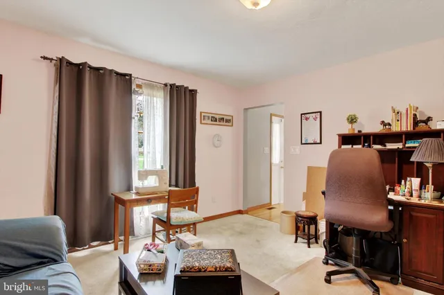 a workspace with furniture and a window