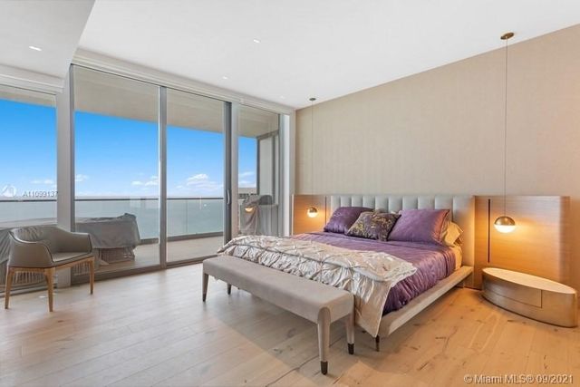 a bedroom with a bed and walk in closet