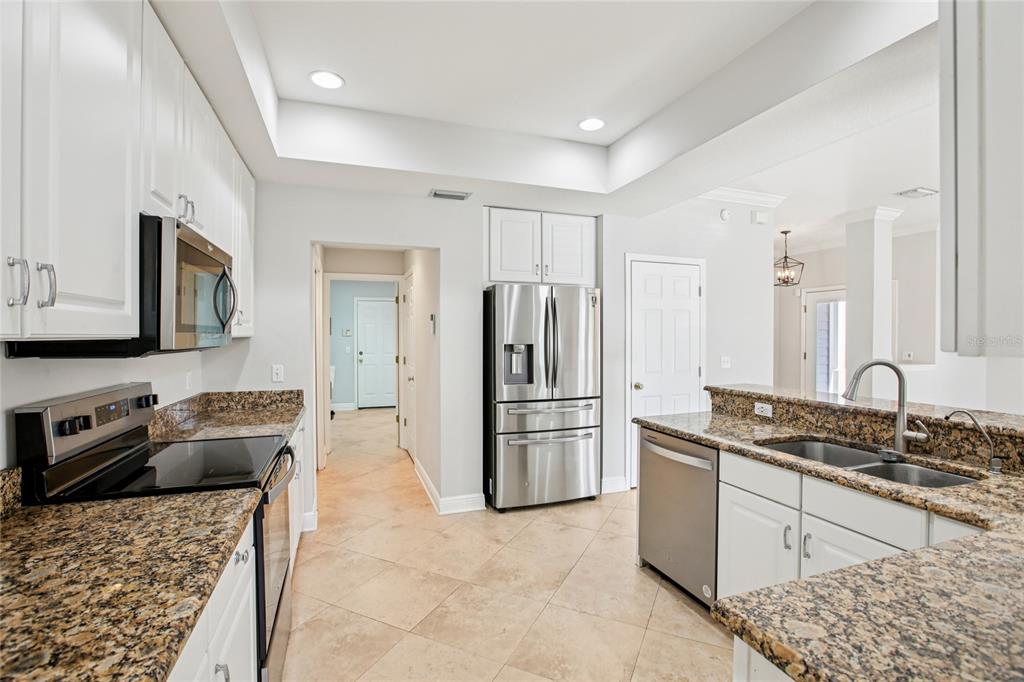270 Cleveland Avenue Southwest Largo, FL 33770 - Photo 12 of 35 a kitchen with a refrigerator stove and sink