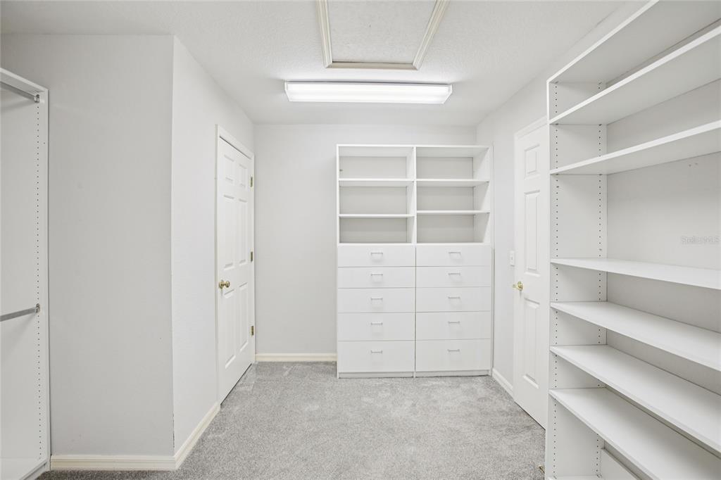 270 Cleveland Avenue Southwest Largo, FL 33770 - Photo 13 of 35 a view of an empty walk in closet