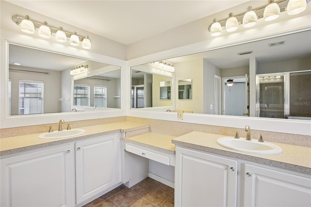 270 Cleveland Avenue Southwest Largo, FL 33770 - Photo 18 of 35 a bathroom with a tub sink and mirror