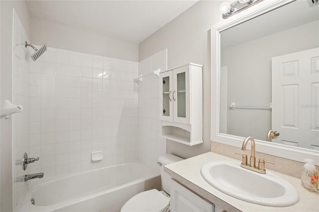 270 Cleveland Avenue Southwest Largo, FL 33770 - Photo 21 of 35 a bathroom with a sink toilet and shower