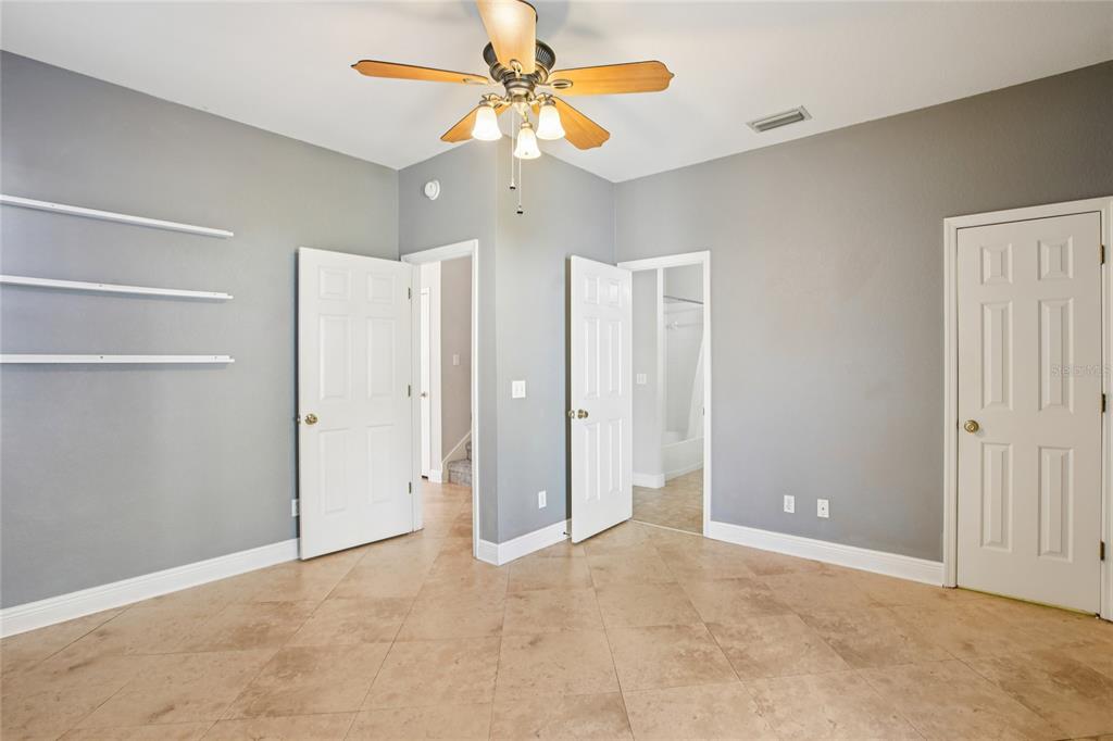270 Cleveland Avenue Southwest Largo, FL 33770 - Photo 23 of 35 a view of an empty room with a ceiling fan