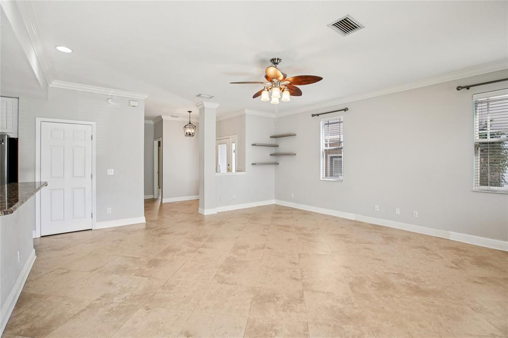 270 Cleveland Avenue Southwest Largo, FL 33770 - Photo 34 of 35 a view of a livingroom with a chandelier fan and windows