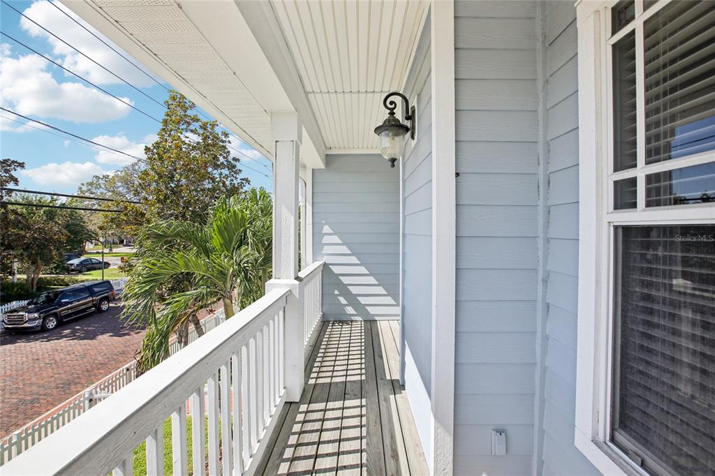270 Cleveland Avenue Southwest Largo, FL 33770 - Photo 6 of 35 a view of a balcony with wooden floor and windows