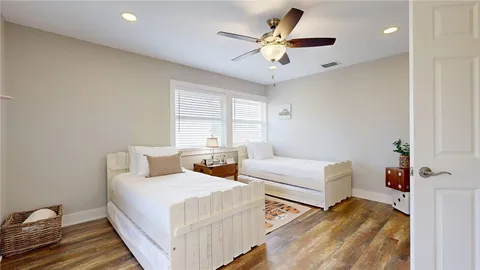 a bedroom with furniture and a chandelier