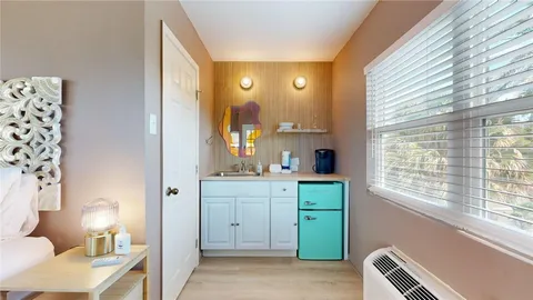 a spacious bathroom with a double vanity sink a toilet and a window
