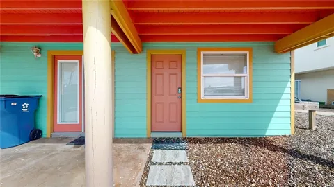 a view of a house with a door and a window
