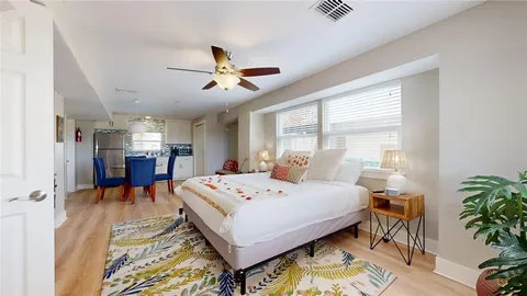 a bedroom with a bed and a table