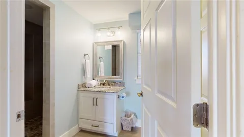 a bathroom with a shower and a sink