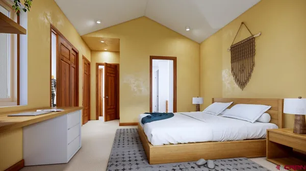 a bedroom with a bed and a mirror