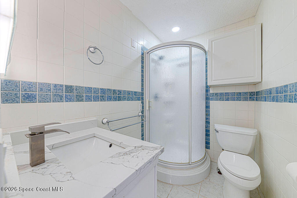 2773 Hickory Circle Mims, FL 32754 - Photo 14 of 45 a bathroom with a sink a toilet and shower