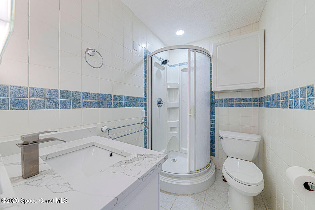 2773 Hickory Circle Mims, FL 32754 - Photo 15 of 45 a bathroom with a sink a toilet and shower