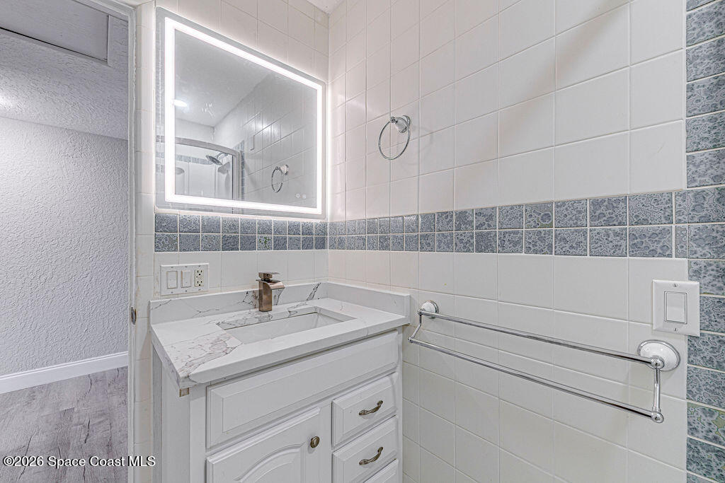 2773 Hickory Circle Mims, FL 32754 - Photo 16 of 45 a bathroom with a sink and a mirror