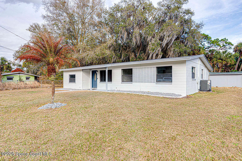 2773 Hickory Circle Mims, FL 32754 - Photo 3 of 45 a house with trees in the background