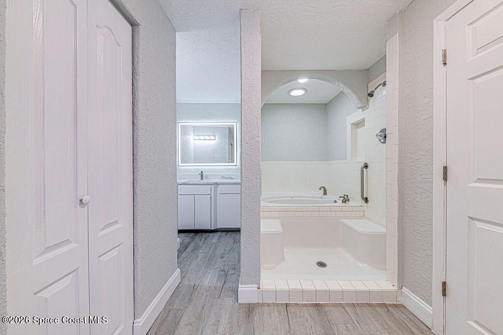 2773 Hickory Circle Mims, FL 32754 - Photo 31 of 45 a bathroom with a bathtub and a shower